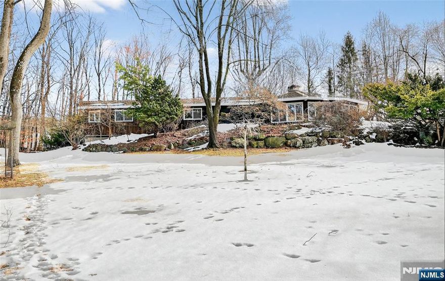 Nestled in the highly desirable Cragmere section of Mahwah, this one-of-a-kind 3-bedroom, 2-bath ranch sits on 1.6 picturesque acres, part of a former apple orchard, and has been lovingly maintained by its original owner. The homeâ€™s stunning octagon-shaped great room is the true centerpiece, featuring vaulted wood ceilings, a dramatic floor-to-ceiling stone fireplace, and a wall of windows that frame breathtaking views of every season, including spectacular sunsets over the Ramapo Mountains. The kitchen is full of rustic charm with cabinets and accent walls crafted from reclaimed barnwood, adding warmth and character you wonâ€™t find anywhere else. Surrounded by natural beauty yet conveniently located near top-rated schools, public transportation, major highways, parks, shopping, and dining, this special property offers the perfect blend of privacy, character, and convenience. Experience the very best of Mahwah living! WANT MORE INFO? CONTACT LISTING AGENT YVONNE MAYO @ 201-376-9849//yvonne@minettidennisgroup.com