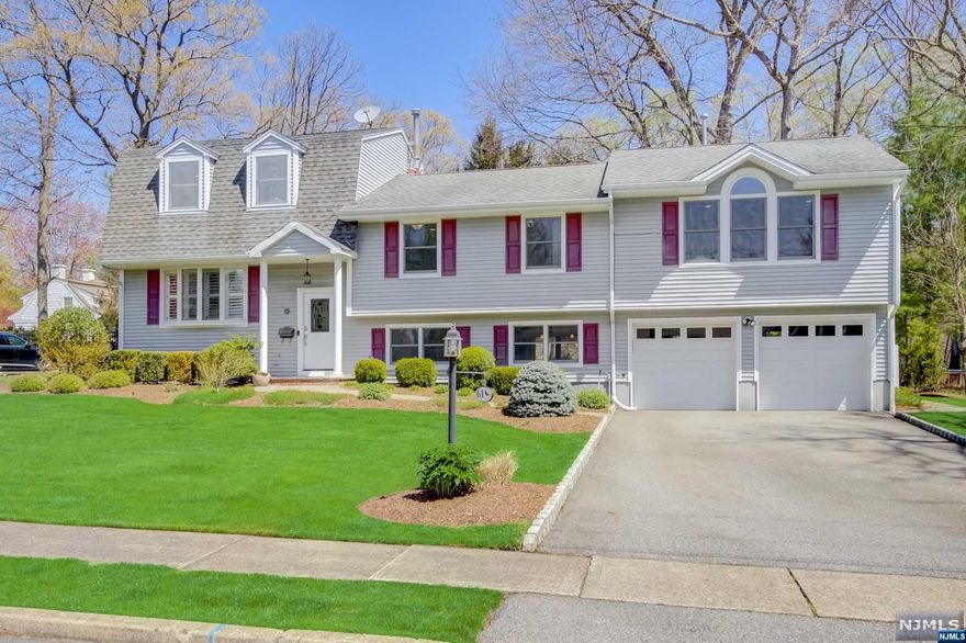 *******BEST AND HIGHEST BY END OF DAY WEDNESDAY MAY 1ST******** Located in an incredible neighborhood on one of the most desirable streets in Oakland, this spacious Split is tastefully updated and expanded, and epitomizes 'move-in condition'. Sporting a gorgeous granite and S/S kitchen, updated bathrooms, beautiful hardwood floors, a huge Owner's Suite, a Jacuzzi on the paver patio, newer HVAC and windows and lots more, it's all only a few hundred yards from NYC transportation! The bedrooms are spacious and have the Laundry nearby, and the property is professionally landscaped and allows for seasonal views of the lake. Literally nothing to do but move in, unpack and enjoy.