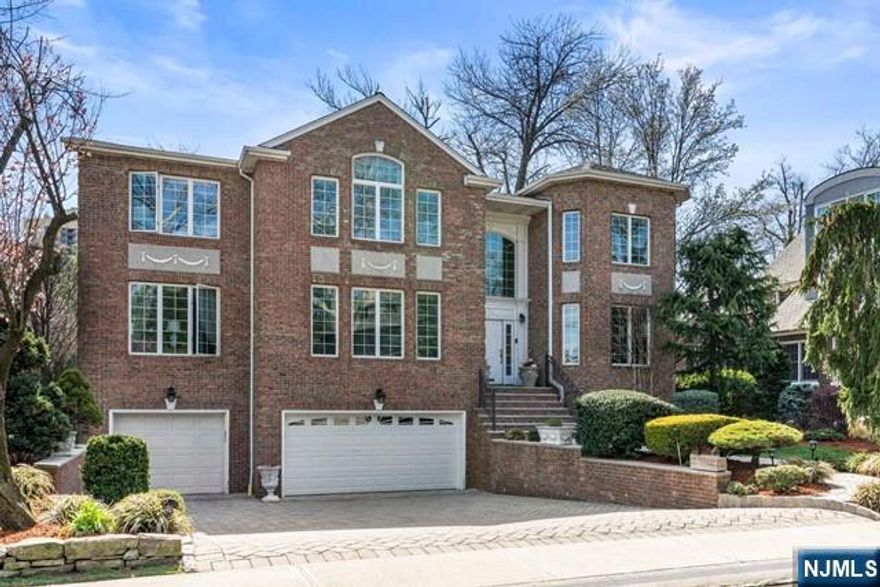 Exceptional and Exquisite all-brick colonial with a heated in-ground pool, located in the most scenic and prestigious bluff section of Fort Lee. This custom-designed estate offers 5,699 sq ft of luxurious livingâ€”4,336 sq ft above grade plus a 1,363 sq ft fully finished basementâ€”designed for elegance and everyday comfort. A grand, sunlit two-story foyer welcomes you into an expansive living room, a warm family room with gas fireplace, and a modern chefâ€™s kitchen featuring a large granite island and high-end appliances. The breakfast room overlooks the lush, private backyard oasis. A formal dining room, home office/den, and stylish powder room complete the main level. The second floor boasts a stunning primary suite with a spa bath, Jacuzzi, second gas fireplace, and two walk-in closets. A junior suite with cathedral ceiling and two more junior suites offer luxurious accommodations, enhanced by gleaming hardwood floors. The finished basement includes a spacious bedroom, full bath, recreation/media room, gym, and direct access to a heated 3-car garage. With 6-zone heating, a water softener/purifier system, and close proximity to NYC, top schools, fine dining, and shoppingâ€”this exceptional home offers timeless elegance and modern convenience in one of Bergen Countyâ€™s most desirable neighborhoods. A must-see!
