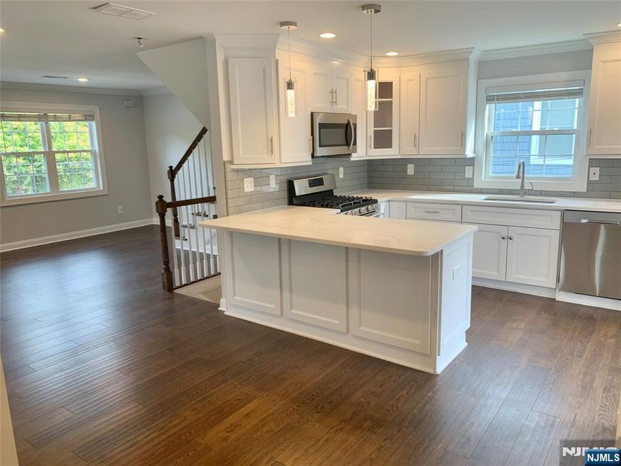 Tastefully renovated apartment with an open floor plan the features 3 bedrooms with walk-in closest, 2 bathroom, Large living & dining room combo and an eat-in, open concept kitchen with a breakfast bar that leads to a deck perfect for al fresco dining. Other features include: hardwood floor, central AC & heat, new windows and a, entrance foyer. There is also a laundry room, large hallway closets and a 9'x16' storage room on the 2nd floor. The apartment comes with use of 1 garage space, plenty of parking and a small yard. Located in walking distance to Bloomfield Ave shopping and entertainment, public transportation and houses worship.