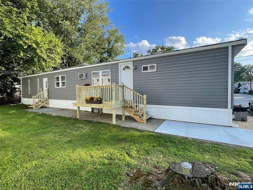 New opportunity to own vs rent in Wayne's desirable Finns Mobile Home Park. This 2 bedroom ,1 & 1/2 bath home was renovated in 2023.Newer luxury vinyl plank floors, crown molding and baseboards. Enter into the living room, with a good-sized bedroom to your right. To your left is the dining area / eat in kitchen depending on how you set it up. Continue down the hallway, pass the half bath on your right and second exit on your left. Straight ahead is the primary bedroom with ensuite full bath. Enjoy the warmer weather seated on the newer deck. Great opportunity to fence in the amply yard for private outdoor space. Potential buyers must fill out community application and be approved before an offer can be accepted. Current NTN required. Cash preferred / mortgage company information available. $1000 monthly fee- includes lot rent, water, septic, plowing, maintenance of common areas