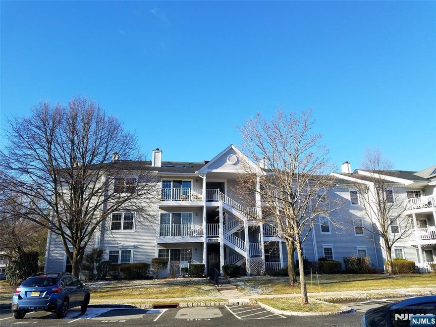 Pristine Light & Bright First Floor End-Unit Condo that shows beautifully! Lovely wood floors throughout, updated Kitchen & baths, Newer windows & Sliding Glass door in Living Room which leads to a covered Patio. Located in a wonderful community offering tons of parking, clubhouse, pool & tennis court. Nearby schools, shopping, parks , highway & NYC transportation.