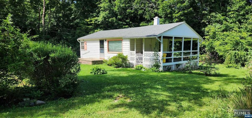 Live in a desirable lake community and be close to Route 23 and NYC transportation. Enjoy nearby water park, skiing, golfing, ice rink, restaurants, and more. This 2 bedroom ranch style home is longing for a total makeover. Bring your imagination and decorating ideas. Do you love the outdoors? There is plenty of room to create cozy outdoor spaces beginning with the covered patio and spacious yard. The patio has the potential to be an enclosed three season room, offering more living space. This home is being sold As-Is. Buyer will be responsible for well water testing. Cash or renovation loans.