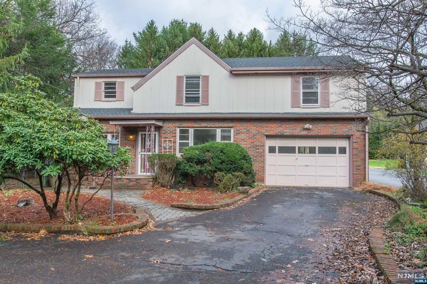 IMAGINE THE POSSIBILITIES! This spacious 4 bedroom, 1.1 bath colonial is just waiting for your design eye to bring it back to its former glory. Set back from the street & located on one half acre of private lot, this home enjoys a recently renovated in-ground pool, circular driveway w/ plenty of parking & a yard meant to host fabulous parties & holiday events all year round! Sunny living room w/ sliders to deck/bay style window/elegant fireplace mantel w/ storage built-ins, formal dining room boasting an open flow into the eat-in kitchen w/ sturdy wood cabinets/stainless steel appliances/recessed lighting. Nicely renovated powder room, finished basement ideal for rec room/play area/home office. Upstairs boasts 4 sizable bedrooms w/ ample closet space & full bath w/ tub. House is NOT in a Flood Zone. Near NJ Transit train to NYC (MSU station), shops, schools, restaurants, parks, this home is an investor's DREAM!