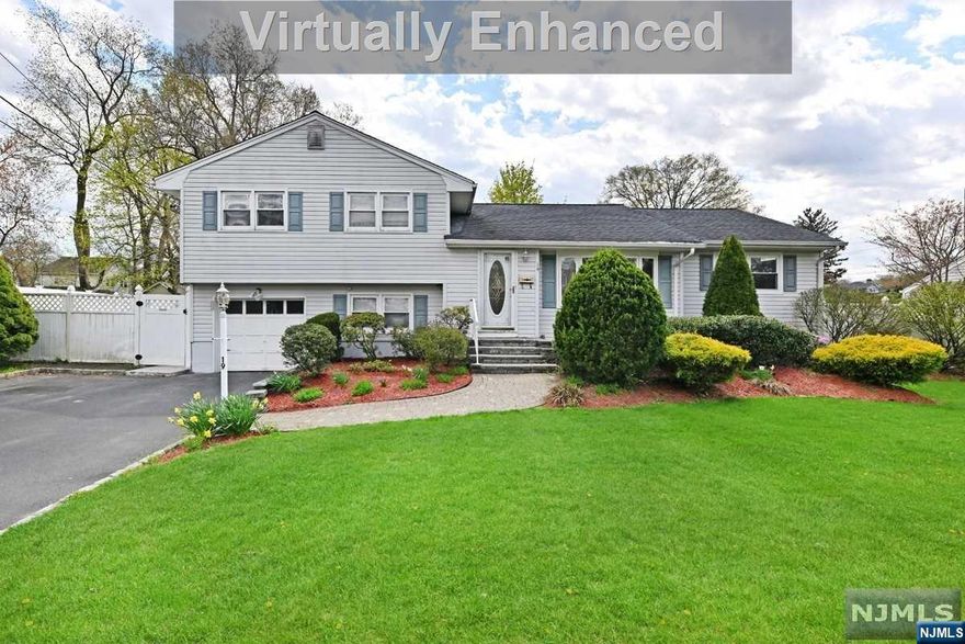 Don't miss the home you've been looking for! This expanded 4 BR 3 full Bth S/L has an I/G Pool, an oversized 100x100 lot & fenced-in yard. Quiet st, yet convenient to all, incl shopping & NY bus & train Summer fun has begun as soon as you close & open up the beautiful pool w/a 2 yr old newer vinyl liner. The pool has been enjoyed by owner every summer, including last summer. This spacious home is approx 2,136sf home. It's perfect for entertaining & multi-generational living. The addition consists of: an expanded MEIK w/dining area, expanded FDR, 1st floor MBR w/walk in closet & MBth and a Great Room w/gas FPL & pretty barrel ceiling. Ground flr has a family room & access to 1 car garage. Bsmnt is perfect work from home area. Central Air. Cool top concrete around pool. Front & back paver patios. Timberline roof. EF w/coat closet. Vinyl fenced-in yard. Shed No known issuse but sold as-is condition, incl driveway, patios & pool. Close to NY trans, schls, worship & shopping.