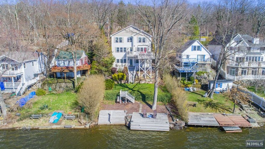Stunning Custom Built Luxury Lakefront. Ideal East Shore location on Greenwood Lake! An Entertainer's Dream House. Top of the Line Everything! 3 BRs, 3.5 Baths. Gourmet Granite Kitchen w Breakfast Bar, Stainless Appliances, and Custom Kraft Maid Cabinetry, Formal DR w Spectacular Lake Views. Beautiful LR w Gorgeous Built in Gas Fireplace and Entrance to Upper Deck Overlooking the Water. Master Suite includes WIC, Full Bath with Whirlpool Tub, Stall Shower and Granite Vanities. Lower Level includes Spacious Family Rm, Guest Rm, Additional Kitchen, Full Bath, and Walk-out to Back Yard. Amazing Attention to Detail Throughout! Glistening Hardwood Floors, Crown and Base Moldings, Views of the Lake All Around! Too Much to List! A Truly Spectacular Home! Greenwood Lake offers Motor Boating, Kayaking, Swimming, Fishing, Jet Skiing & More! Just 1 Hour To NYC, & Close To Major Highways, Shopping, Dining, Golf Courses, Ski Resorts, Wineries, Apple Orchards, Drive-In Theater & So Much More!