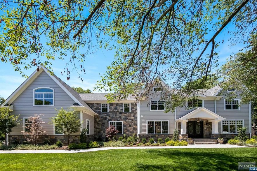 Custom Built Center Hall Colonial, barely 2 years young. Built on original foundation. Details have been carefully curated in the design process. High level finishes throughout: 3 fireplaces (bedroom, dining room, family room), 4" white oak plank flooring, whole house generator, custom kitchen with double island, Hal white Carrera quartz counter & island- Wolf 8 burner with pot filler and double oven, stainless steel appliances, and sliding glass doors to paved patio w/ custom built in BBQ station. Soaring 2 story family room w/ wall to wall window and coffered ceiling- french doors leading to private patio w/ custom built in firepit. Granite slab fireplace in DR w/ custom dry bar. High energy efficiency heating and cooling system. Black Carrera flooring in kitchen. 9 Foot flooring throughout the home, 10 foot in kitchen. Fenced in yard. Just move in- start living. Lower taxes, Blue Ribbon schools, and 15 miles to NYC.