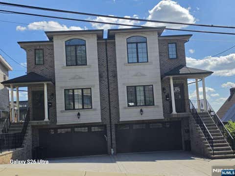 Photo of 304 E Palisades Boulevard, Palisades Park, NJ 07650 (MLS # 26023510)
