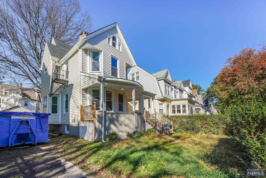 Gut renovated, turnkey 2-family with parking on a quiet residential block boasting all new plumbing, electrical, and HVAC, newly renovated kitchens with stainless steel appliances and quartz countertops, (3) brand new bathrooms. Apt. 1 (1st floor) features 2BR/1BA w/separate entrance in rear. Apt. 2 includes 3BR/2BA across two floors, including master BR w/en suite bathroom on top floor. Newer roof and brand new siding. Unfinished basement. Driveway + detached garage. Driveway will be paved prior to sale. Owner is licensed Realtor.