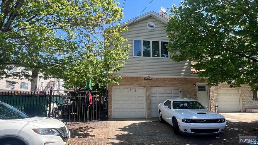 Don't miss out on this prime investment opportunity! This two-family home in Newark's coveted Ironbound neighborhood offers more than just living space it promises a vibrant lifestyle and impressive returns. With parking for six cars, including a garage, convenience is guaranteed. The first floor boasts two bedrooms, one bath, and a new AC system, while the second floor offers three bedrooms and one bath. Both units feature laundry facilities, appealing to discerning tenants. Commuting is easy with nearby highways and public transit, including Penn Station. Live in one unit and rent the other, or maximize your investment potential the choice is yours. The Ironbound area is rich in culture with attractions like the Prudential Center and NJPAC, plus numerous dining and shopping options. Don't let this opportunity slip away; invest in your future today!