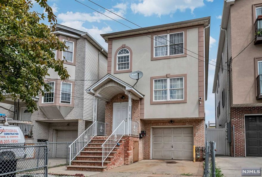 Just 3 blocks from the NEW Elizabeth Fast Ferry to NYC Pier 15 Lower Manhattan! Seller is including a 40 trip pass in the sale of this outstanding investment property. With taxes being only 11,700 this property has incredible value adds. Located on a dead end street with an outstanding fenced in patio showcasing paver interlocking stones you will feel as though you are enveloped in privacy. In addition to the main and second floor which boasts 3 large bedrooms plus 2 baths in each unit, this gem has a ground floor including an additional 2 bedrooms 1 bath and kitchen with living area. Public transportation is at your fingertips making this home an amazing find.