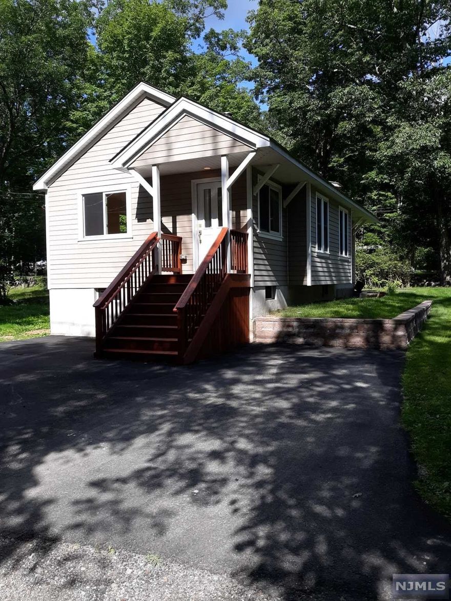 Don't miss out on the great opportunity to own instead of renting this starter house or 2nd home on private dead end street while enjoy8ing all year round activities. Tranquil lakestyle/bungalow with 2 bedrooms, 1 bath. Walking distance to the UGLP POA lake access/clubhouse/beach. WB stove in living room, great natural light from 5 skylights, 2 are ventable w/remote, center air, heat. Septic replaced 2018, hardwood floors, EIK w/pantry, laundry, storage in pull down attic and heated crawl space, freshly painted.