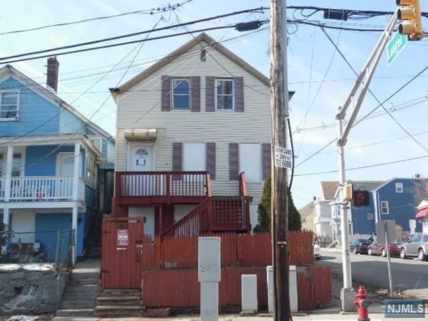 Colonial style home situated on a fenced in corner lot, maintenance free vinyl siding, on street parking & public transportation at your doorstep. Large, enclosed porch off the dining room with access to the backyard. Home is conveniently located to everything. Property is in need of renovation & is being sold in "as is" condition. All town required inspections to close are responsibility of the purchaser. Proof of Funds or FHA 203K letters to accompany all offers.