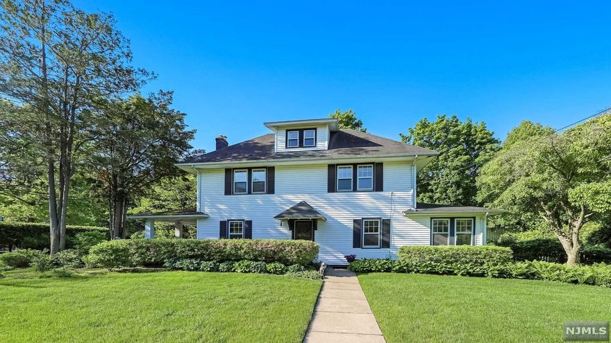 Classic Ridgewood Colonial in Premium location! 4 bedrooms, 2 1/2 baths, beautiful moldings and hardwood floors throughout. Large Living room with wood burning fireplace and french doors to covered side porch. Updated kitchen is bright and cheery with marble countertops and newer appliances. Family room/ Sunroom full of windows overlooking impeccable gardens with southern exposure. Second floor has three bedrooms, newer full bath and second story porch. Third floor bedroom is spacious with sitting area. Basement is finished with half bath. Enchanting backyard was once featured in 201 Magazine - lush with plantings, large lawn and fire pit for gatherings - your own private oasis! This home is quintessential Ridgewood, close to schools, Parks, Graydon Pool, Downtown shopping, restaurants and transportation to NYC!