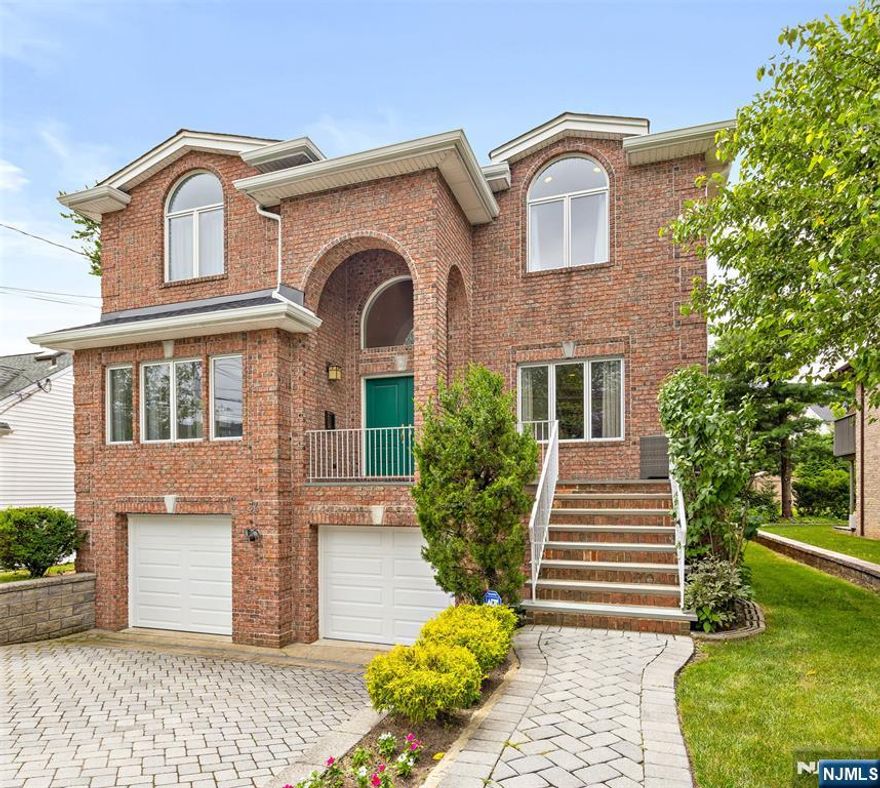 Welcome to 34 Bayview Avenue in the sought-after community of Englewood Cliffs! This expansive 6-Bedroom 4.5-Bath Colonial offers over 5,000 sq ft of beautifully finished living space with a layout designed for both everyday comfort and entertaining. At the heart of the home is a stunning Modiani kitchen with custom cabinetry, Caesarstone countertops, Wolf and Sub-Zero appliances, and a Miele dishwasher. The open plan flows into the dining area and spacious family room with fireplace. French doors lead to a private Trex deck surrounded by lush greenery. Upstairs, the oversized bedrooms include a luxurious primary suite with oversized bath and dual walk-in closets. The finished lower level offers flexible space for a gym, media room, and guest rooms. Additional highlights include hardwood floors, EV charger, top-grade gutters, a 2-car garage, and a paver driveway. Minutes from Fort Lee and the GW Bridge, this move-in-ready home is perfect for commuters.