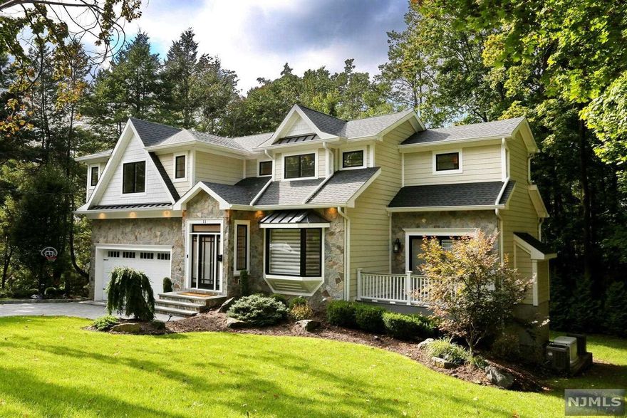 Welcome home to this stylish and functional custom colonial located on desirable East Hill on a private street. A formal entry leads to spacious family room with fireplace to enjoy cozy fall and winter nights. Extensive trim and moldings throughout. A stylish open chef's kitchen featuring marble counter tops and top of the line appliances including Wolf range, Subzero Refrigerator and Bosch Dishwasher. Enjoy a serene master bedroom en-suite with tray ceiling and walk in California Closets plus luxurious spa bath with marble double vanity sink. Three additional bedrooms with impeccable custom finishes and radiant heat in all baths. Finished lower level with bedroom/full bath, recreational/play room. Ground level access to patio and private grounds. Additional amenities include generator, central vac, wide plank flooring and high ceilings throughout. Close to schools and just 8 miles to NYC. A dream home...