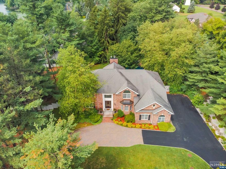 THIS UPDATED CUSTOM 5 /6 BEDROOM COLONIAL HAS IT ALL,INCLUDING THE PRESTIGIOUS "MILL GATE" LOCATION OF FRANKLIN LAKES! YOU ARE WELCOMED INTO THE GLEAMING 2 STORY MARBLE EF, LARGE BANQUET SIZE FOMAL DR, FORMAL LR, TWO-STORY IMPRESSIVE GREAT ROOM/MARBLE FPL AND GRANITE WET BAR, BR/OFFICE,FULL BATH.GOUMET CUSTOM KITCHEN W/ GRANITE TOP CENTER ISLAND & HIGH END APPLIANCES.THE SECOND FLOOR OFFERS PRIMARY SUITE/3 WI CLOSETS/CREMA MARBLE LUXE BATH.EN-SUITE BDRM. TWO BR'S/SHARED UPDATED FULL BATH. FABULOUS WALK OUT FINISHED LOWER LEVEL,OFFERS HOME THEATRE/GRANITE WET BAR/GAME ROOM/FBTH,SAUNA & ADDT'L UPDATED SHOWER + BEDROOM/GYM.CUSTOM DESIGNED WINE & LIQUOR STORAGE FOR THE ENTHUSIASTS & COLLECTORS. RESORT STYLE REAR INCLUDES BOULDER EDGE POOL/SPA WATERFALL, KOI POND/WATERFALL BUILT IN OUTDOOR KITCHEN,HOT TUB, MOON LIGHTING, SURROUND SOUND FOR YEAR ROUND ENTERTAINING.CLOSE PROXIMITY TO THE MARKET BASKET & INDIAN TRAIL CLUB. EUROPEAN CRAFTSMANSHIP CUSTOM WOODWORK THROUGHOUT + GENERATOR.