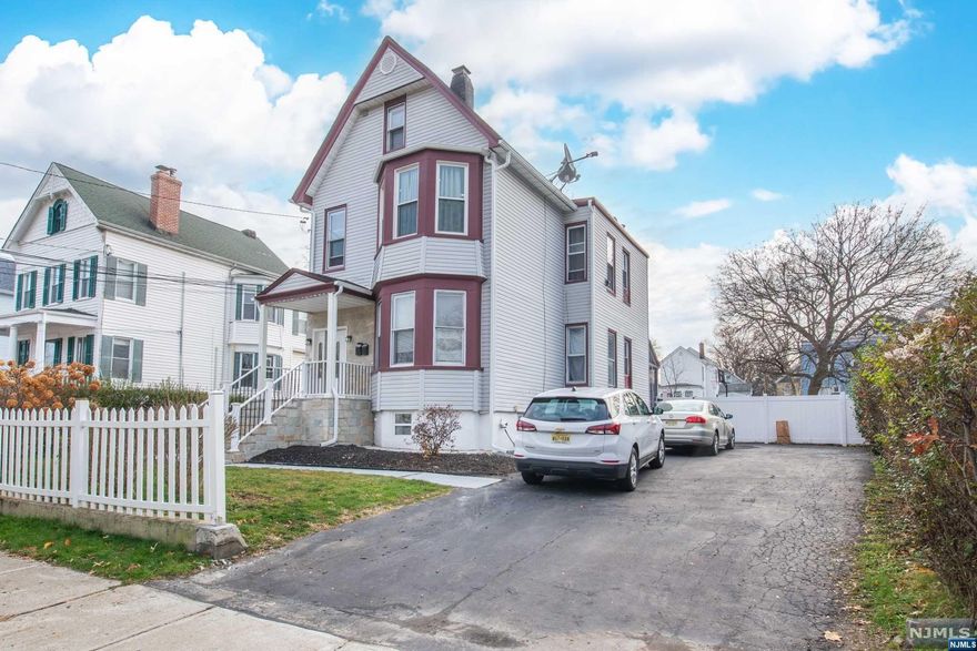 Discover this spacious and recently renovated 2-family home, featuring a total of 5 bedrooms and 4 full baths. The 2nd flr unit was updated, with a sleek on-suite bathroom and the convenience of central HVAC for optimal comfort. While the 1st flr unit with the same layout as the second, presents opportunity for customization. Equipped with hot water baseboard heat , it offers a traditional and reliable heating option. Outside, a generously sized backyard invites relaxation, play, and entertainment, providing a private oasis within the property. With ample space for 6 cars, parking is never a concern, ensuring convenience for all. Benefiting from excellent commutability, this home is strategically located with easy access to major transportation routes. This versatile property offers a blend of modern comfort and potential, making it an ideal for dual living arrangements, rental income, or a combination of both.