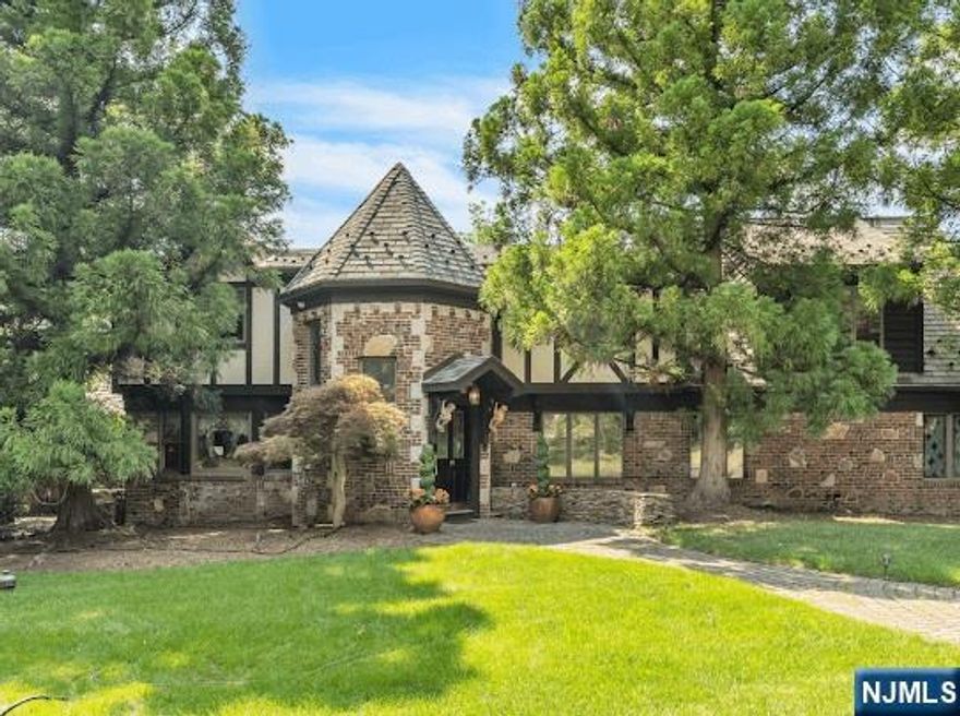 Beautifully appointed Tudor Manor situated on over 1.6 picturesque acres, located in the heart of the sought after East Hill. Office/ library, great kitchen opens to dining room and a very well-designed wine cellar (thermostatically controlled), huge family room with fpl/vaulted great room opens to exterior multi-level patio/outdoor fpl and professionally landscaped grounds. The interior also offers a sauna, music/living room, great bedroom/bath layout on top floor and secondary office space. Septic was designed to accommodate 5 bedrooms. 4 car garage.