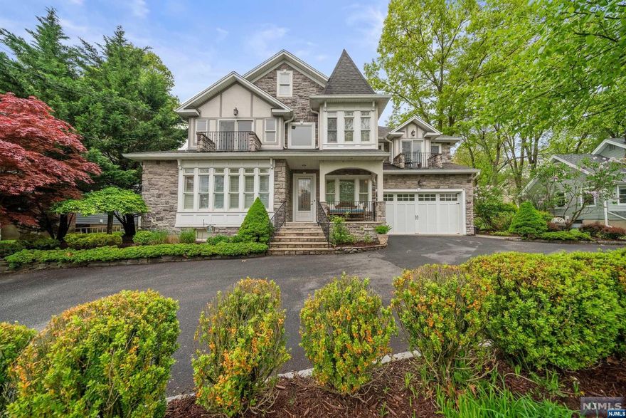 Experience the epitome of lakeside luxury in this custom-built residence, gracefully designed w/ an emphasis on spacious & elegant living. Boasting high ceilings & exquisite built moldings, this home features a stunning combination of wrought iron & wood on a sweeping staircase, accompanied by Bahama shutters & rich hardwood floors throughout. Cozy up to 2 stone gas fireplaces in the great room or living room. Culinary enthusiasts will delight in the gourmet kitchen equipped w/ high-end appliances, granite countertops, & a custom-built bar complete w/ a wine rack & cooler. The finished lower level offers additional space for entertainment & relaxation. The walk-up attic is perfect for storage or completing it for extra living space. Enjoy the beautifully landscaped, fenced-in backyard w/ a paver patio & a custom natural waterfall, creating a serene retreat. Enjoy morning coffee or sunset views from one of the 2 blue-stone balconies. Located in a community w/ luxurious amenities.