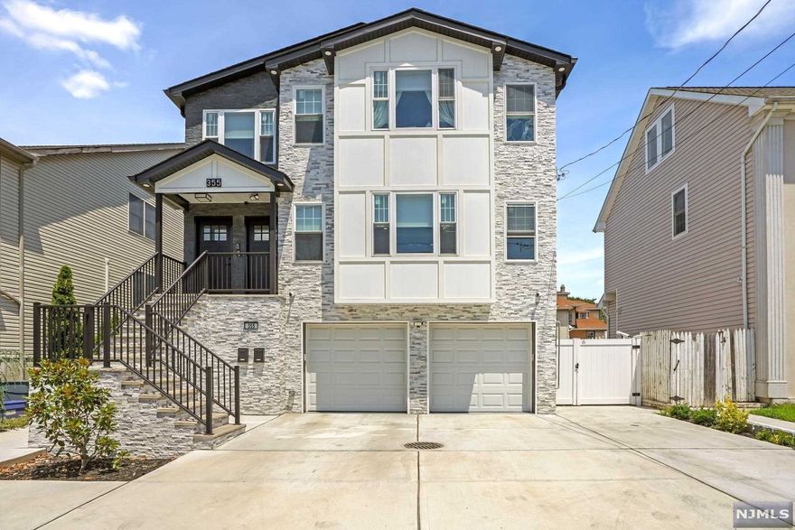 Proudly presenting this absolutely stunning two-family home with a beautifully landscaped rear yard oasis boasting a heated ground salt water pool. This exquisitely designed living space boasts state of the art finishes that include two gourmet chef kitchens with quartz countertops, high-end stainless-steel appliances, open / inviting living / dining area, luxurious primary suites with spa designed bathrooms, guest suite with private bathroom and spacious bedrooms. Home highlights include a fully equipped Smart house system, hi-tech indoor/outdoor surveillance system, keyless entry system, porcelain tiled flooring, hardwood flooring, central heat/ac, euro style light fixtures, tankless water heater, two laundry rooms, plenty of storage two car attached garage with brick paved driveway for additional vehicles. Area features include top ranked schools, NJ Transit bus to NYC is two blocks away and short distance from train station. Truly A Must See Home that will NOT last!