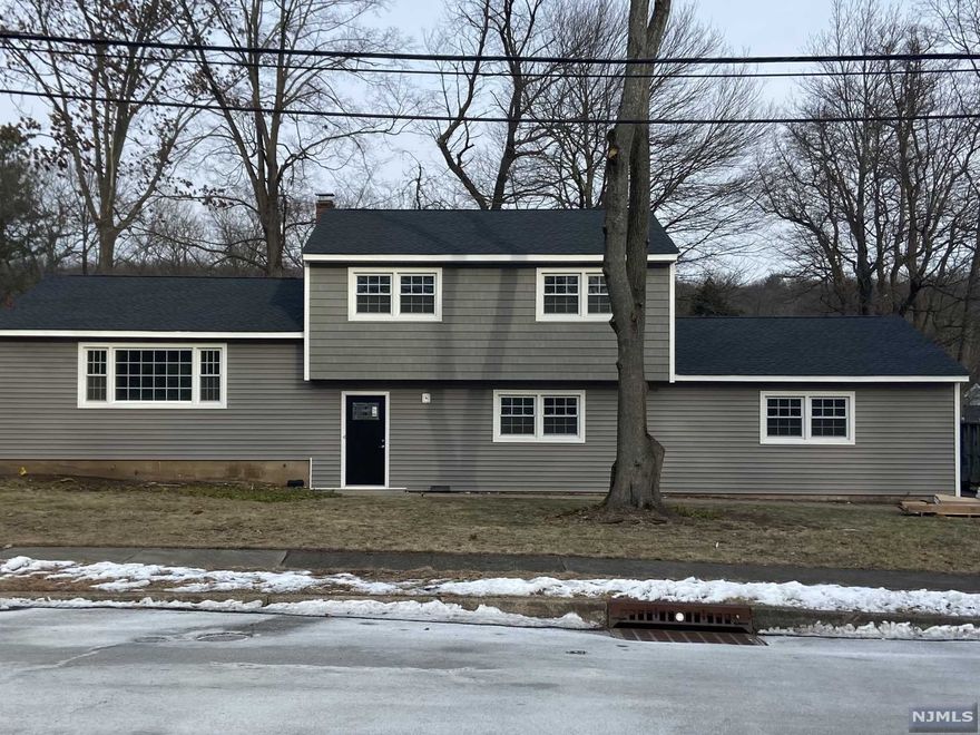 Move right in to this 4 bedroom, 3 bathroom split level home on the Wayne Hills side of Wayne Township. Recently renovated to include new roof, vinyl siding, furnace, central air, and water heater. Newly installed and refinished hardwood floors throughout. House has been freshly painted with new interior and exterior doors, kitchen with SS appliances and granite counters, and renovated bathrooms. Two car attached garage and unfinished, partial basement. Just a short distance to Wayne Township Kilroy Park and Toms Lake.
