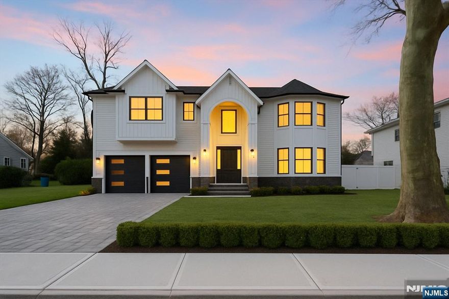 Discover this custom-built 6-bed, 5.5-bath Paramus estate redefining modern luxury. A marble foyer with soaring ceilings and an adjustable chandelier welcomes you. White oak floors, coffered ceilings, and ambient lighting enhance the elegant design. The chefâ€™s kitchen boasts Wolf appliances, quartz counters, soft-close cabinets, and a butlerâ€™s pantry. Open living/dining spaces flow to the outdoors through oversized windows. A first-floor en suite offers use as a guest room, office, or library. Upstairs, the primary suite features a walk-in closet with center island, spa bath with dual rainfall showers, soaking tub, and double vanity. The finished lower level includes a theater, gym, bedroom, full bath, and kitchenette with bar. Smart home features include Bluetooth speakers, smart panels, and customizable controls. This home blends comfort, tech, and timeless style.