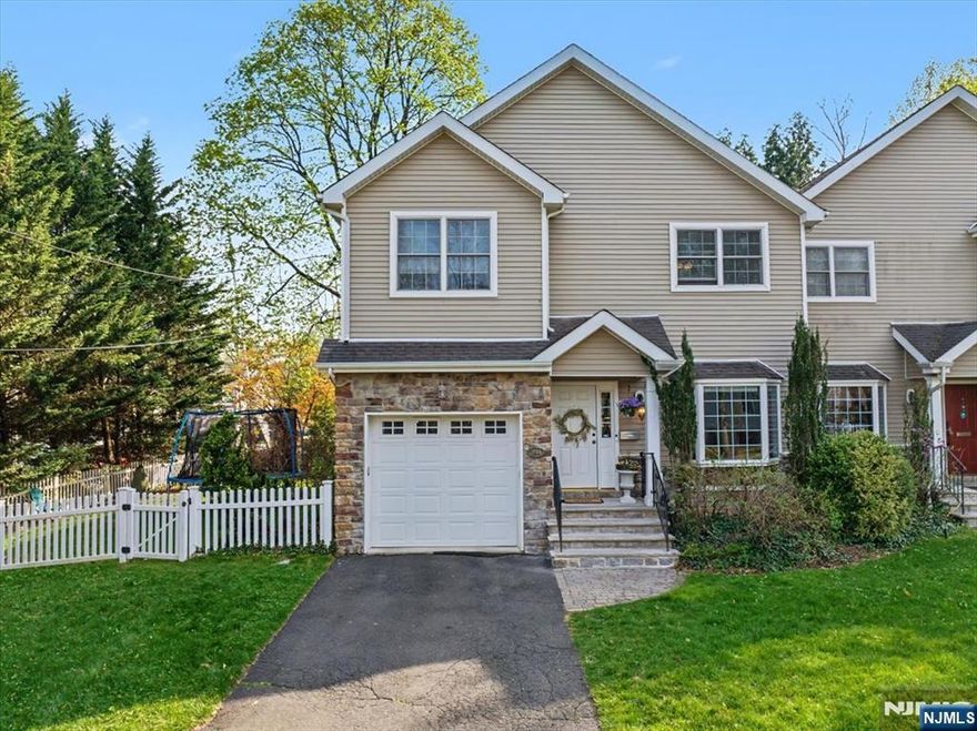 This beautifully maintained 3-bedroom, 3.1-bath custom-built single-family attached home offers the perfect blend of space, convenience, and low-maintenance living, all in the heart of Ridgewoodâ€™s vibrant village. Easy access to boutique shopping, amazing restaurants, and both train and bus service to NYC, the location simply canâ€™t be beat! Spanning 3 levels of living, this home features an open and inviting main floor with 9-foot ceilings, HW floors, recessed lighting, and elegant crown molding. The spacious kitchen with s/s appliances flows seamlessly into the dining room & family room, complete with a gas fireplace and doors leading to a private rear deck in the fenced-in yard. Upstairs, youâ€™ll find 3 generously sized bedrooms, including a stunning primary suite with cathedral ceilings, a WIC, and a luxurious en-suite bath featuring a double vanity, jacuzzi tub, and updated shower. Two additional bedrooms offer ample closet space and share access to a full bath. A conveniently located second-floor laundry closet and attic access via Bessler stairs. The fully finished lower level offers incredible flexibility home office or guest suite, a full bath, recreation/gym area, and storage. Additional highlights include an attached one-car garage, central vacuum, 2-zone heating and air conditioning, and a water softener system. A rare opportunity to enjoy spacious, turnkey living with the ease of condo ownership yet no HOA fees in one of Bergen Countyâ€™s most desirable commu