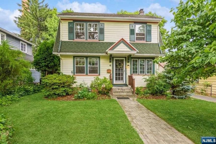 Picture perfect Dutch Colonial located on a quiet cul-de-sac in desirable Glen Ridge close to the Bay Street train station and Montclair shopping. A paver walkway leads to a welcoming sun porch. Inside you'll find chestnut woodwork and crown moldings, diagonal oak floors with ribbon borders and a brick hearth fireplace with a woodburning insert. The modern kitchen is open to the formal dining room and has a built-in breakfast bar and wine storage. The second floor has four bedrooms and an updated full bath. Walk-up stairs to a full finishable attic space. The basement level includes a family room, full bath, laundry area and storage closet. A patio overlooks the sunny fenced backyard with fruit trees and a flower garden.