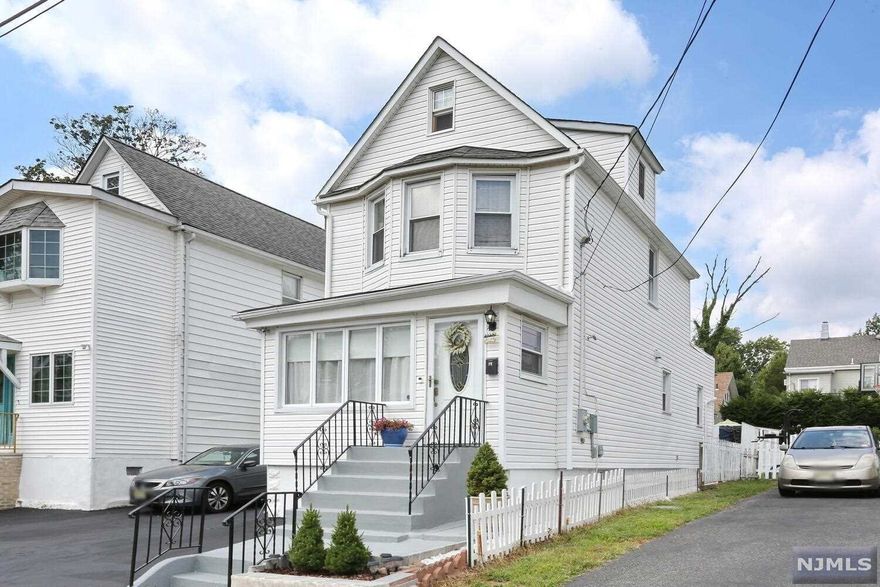 Come and see this beautiful colonial! This property reflects pride of ownership. It is completely updated with an open floor plan, renovated kitchen, the master bedroom suite on the main floor with a full updated bath, 2 spacious bedrooms on the 2nd floor with the 2nd fully updated bath. The backyard is a little private oasis great for entertaining, the basement is full and finished. This property has central air and a new furnace. Walking distance to N.Y.C bus trans, and convenient to NJ highways. Call me for your private showing nothing to do but just pack your bags and move in!!