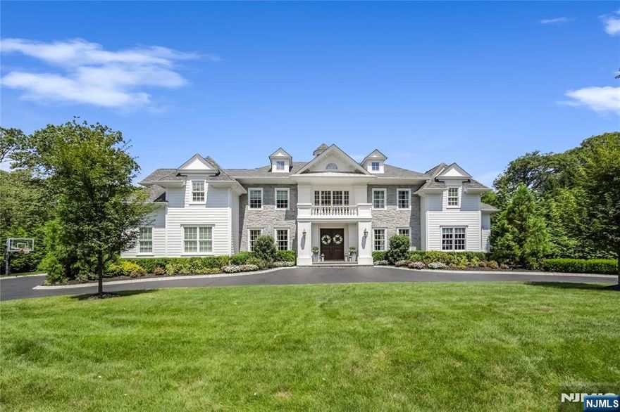 This Magnificent Colonial blends classic elegance with modern amenities, situated in sought-after South Gate. The residence features expansive living spaces, including a grand foyer, a formal dining room, and a cozy yet sophisticated living area with a fireplace. The chef's kitchen boasts high-end appliances, custom cabinetry, and a spacious island, perfect for entertaining. Each bedroom offers generous proportions, with the master suite showcasing a spa-like ensuite bathroom and a walk-in closet. Outside, the meticulously landscaped grounds include a patio, ideal for al fresco dining, and a swimming pool surrounded by lush greenery. Additional highlights include hardwood flooring, intricate moldings, and smart home technology throughout. This property is a true retreat, combining timeless charm with contemporary luxury.