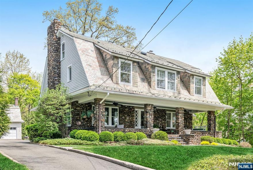 Step into a home full of warmth and positive energy. This elegant center hall colonial boasts a grand entry with a striking 3-story staircase. Offering 6 bedrooms, including a primary suite with a 4 piece bath, and 3.5 baths total, it perfectly blends classic elegance with modern comforts. The chef's kitchen, beautifully renovated and expanded in 2020-2021, features a large island, vaulted ceilings, and top-tier appliances like Sub-Zero and Wolf. This space is graced with numerous windows that offer breathtaking sunrise views and opens to a family room gas fireplace. The living and dining rooms showcase high coffered ceilings and architectural details, including additional gas fireplaces. Enjoy the fieldstone wrap-around porch and a blue stone patio in the back. The yard is professionally landscaped for privacy on this quiet street. A detached 2-car garage with an upper floor provides extra space. This magnificent home offers a seamless blend of elegance and contemporary amenities.