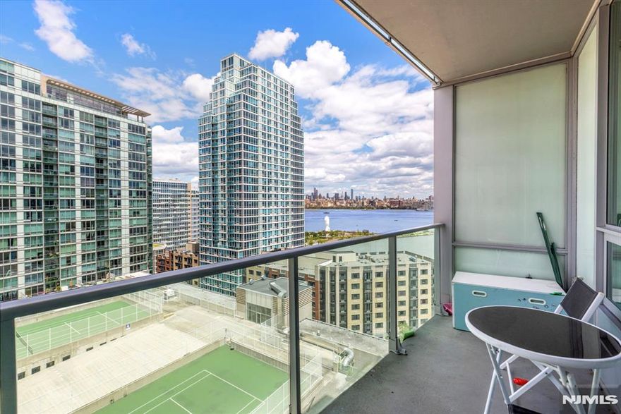 **OH - Sat/Sun (3/21 & 3/22) 1pm - 3pm** Expansive 2 bed + den corner home with private balcony and NYC views in luxury community of 20 Newport Parkway! Chef's kitchen features SS appliances, granite counter tops, and kitchen island. The primary bedroom has a walk-in closet and ensuite bathroom. Additional bedroom, bathroom, and central den space make this the perfect home. Also included are hardwood floors throughout, recessed lighting, window treatments, washer/dryer in unit, and a ton of closet space. The building's generous amenities include 24/7 Concierge, resident lounge, screening room, jacuzzi, sauna/steam room, conference room, fitness center, and a rooftop deck. Conveniently located near Hoboken & Newport PATH, Morton Williams Supermarket, and mall.
