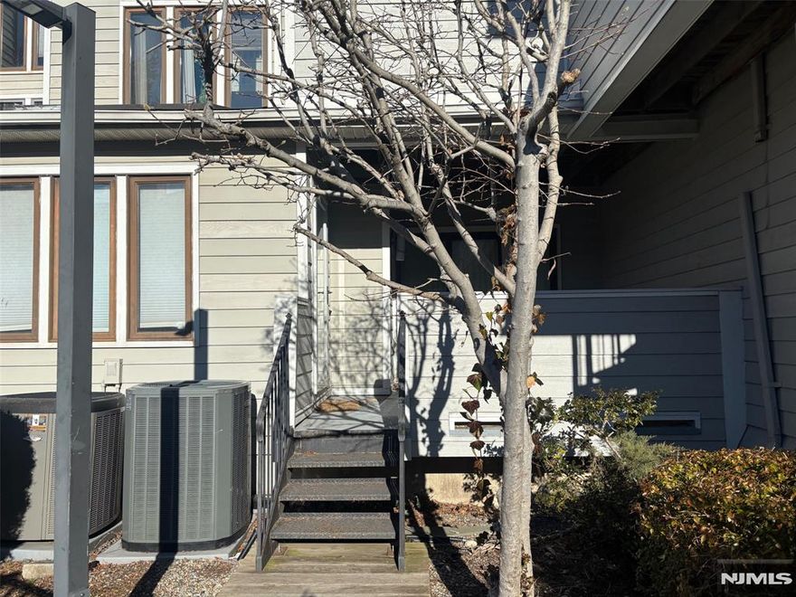 Beautifully upgraded one-bedroom rental in Harmon Cove IV townhomes. Features include a modern kitchen with quartz countertops, coffee cabinetry, and Pfister faucet; updated bathroom with marble shower and smart mirror; hardwood floors throughout; wood-burning fireplace; three skylights; and recessed lighting with dimmers. Private rear deck overlooks community pool. One assigned parking space. All appliances included. Convenient NYC transit access. No smoking of any kind. No pets.