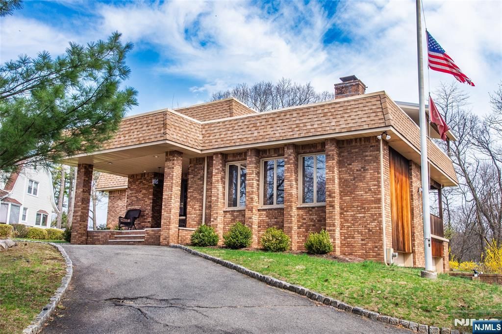 Photo of 845 Rifle Camp Road, Woodland Park, NJ 07424 (MLS # 26011588)