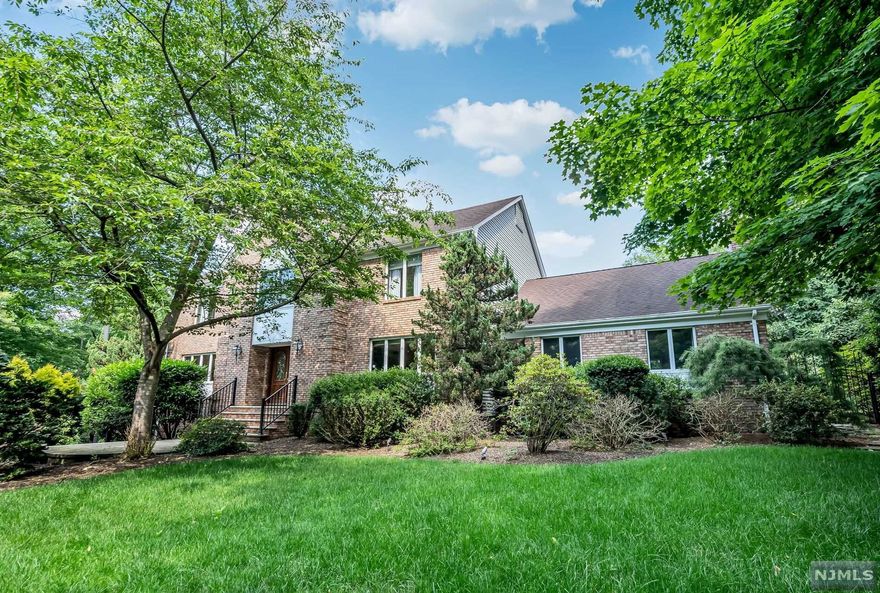 Brick front Center hall colonial set on a private landscaped property with an inground pool. The spacious foyer opens to the large living room 20x15 and formal dining 15x16. The spacious kitchen features a dining area and doors to the deck that also opens to the 23x26 great room that features a soaring ceiling and a fireplace plus doors to the rear deck overlooking the pool. There is a first floor office, laundry and full bath On the second floor the primary bedroom is 21x15 with a walk in closet, dressing area and full bath. 3 additional bedrooms share another full bath. The backyard allows for tons of privacy. The unfinished basement can be finished for more space. Newer AC, multi zones, 8 year old roof, hot water heater 2021. Great location! 3 car Garage!