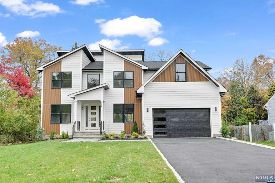 Gorgeous NEW CONSTRUCTION Contemporary Colonial home w 6BDs, 5.5BAs & 5,000+/- sf of finished living space over 3 fl & situated on a flat .34 acre lot. Enter the dramatic 2 story foyer w a sweeping staircase flanked by a formal DR w extensive millwork & Butler's Pantry making entertaining a breeze & formal LR. Beautiful HW fl lead to an expansive Kitchen & FR w electric fp w tile surround; sliders to the paver patio overlooking the lush backyard. The kitchen is complete w modern flat front light oak custom cabinetry to the ceiling, high-end SS appliances, a large center island w coordinating quartz single-sided waterfall top, quartz countertops, Walk-in Pantry & 1st fl en-suite. The 2nd fl is home to 4 BD including a gracious Primary Suite w a tray ceiling, enormous walk-in closet & spa-like BA w soaking tub, stall shower & dual sinks. Additional BD is an en-suite, other 2 BD share a full BA & Laundry for convenience. SMART Home features include Nest, Ring, and EV Charger outlets.