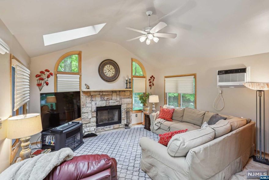 NEW SEPTIC/ROOF 2024! UPDATED KTCHN/3 BTHS! Not your typical Bi-level! This home offers so much versatility including Multi-Generational living options w/finished lower level w/private entrance walk-in shower In-Law Suite Office & Living Rm! But the true gem is the gorgeous Great Rm off the Kitchen! Walk thru the French Doors into this light & bright space w/vaulted ceilings/skylights/FP/sliders to expansive deck! EIK w/beautiful white cabinetry/white quartz counters/SS appliances. Spacious Formal Dining Rm. 3 bedrms on main level. Primary w/direct access to updated main full bath. Refinished hrdwd floors; Ktchn/Formal DR/Hallway & Primary Rm. Secondary Bdrms on ML offer hardwood flooring under carpet. Lrg deck & yard w/plenty of room for entertaining/activities! Easy access to Rt 206/80 (exit 25!), 60 min to NYC, NJ Bus stops! CO Johnson field is the town main park where most youth activities are held plus trails/basketball/tennis/skate park/playground etc! Start here, start here