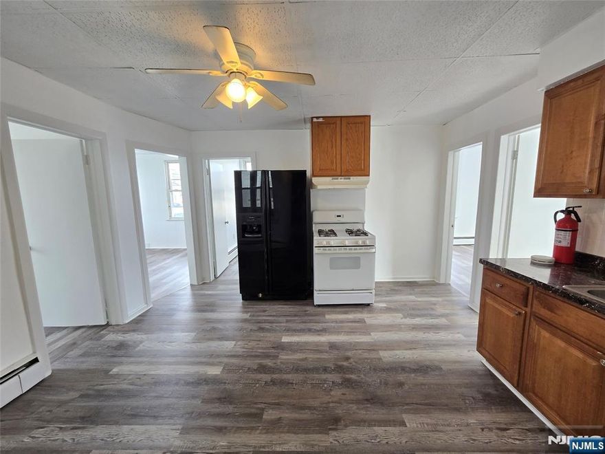 CONVENIENCE!!! Centrally located and perfect for commuters. 4 brm apartment on the 2nd floor for rent in Garfield. Recently remodeled, very clean and bright with brand new paneling floors. Large, modern kitchen with refrigerator, 3/4 bright bedrooms, and cozy TV/living room with wall AC. Decent size of tiled, full bathroom. Hallway with 2 closets, including a large WIC. Sorry, NO laundry (laundromat is across the street), NO pets, NO smoking. Use of backyard. Separate utilities. Application, credit check, and interview required. DON'T WAIT, SET UP YOUR SHOWING TODAY!