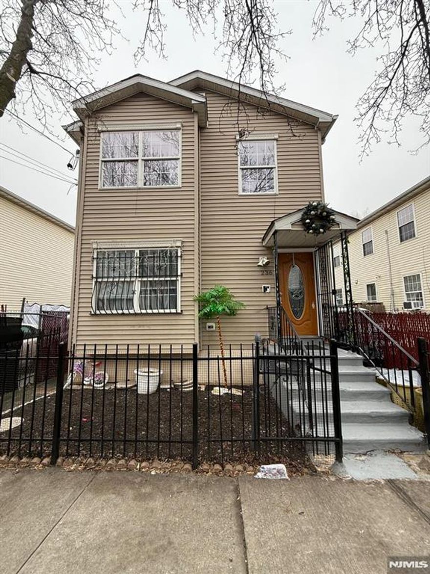 Located in the prime Communipaw section of Jersey City, this property offers over 2,400 sqft of living space, featuring three spacious bedrooms in each unit with separate utilities for added convenience. The first unit includes an in-unit washer and dryer, along with access to a beautiful deck that leads to a large backyard. The second unit is slightly larger and well-maintained but does not have a washer and dryer. There is no basement, only a crawl space accessible from the rear. Additionally, the property is just a short distance from NYC transportation, local shopping, and a variety of restaurants. Dont miss the opportunity to be owner occupant and investor all at once in this income producing property. Call now for a private tour! Property will be delivered vacant. Week-DAY showings with limited access to TWO bedrooms on the 2nd unit. Full access on SUNDAYS only.