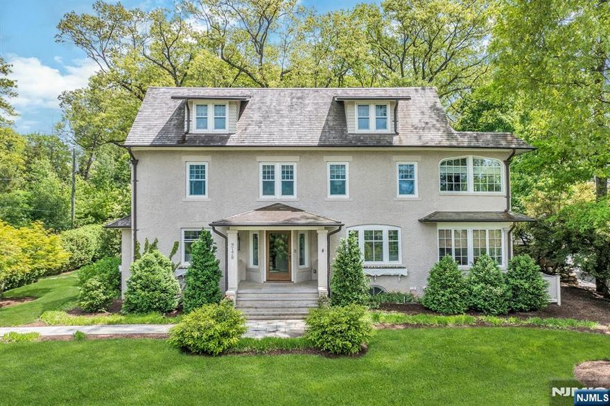 Style, sophistication, and history converge in this thoughtfully and completely renovated Heights Colonial. One of the earliest homes on Heights Road, circa 1905, it was originally built as a â€œsummer retreatâ€ for NYC clientele. Graciously set on nearly half an acre, this remarkable residence offers four stunning levels of living space where timeless architectural character meets modern luxury. From the exquisite cedar roof and custom garage to the bespoke Christopher Peacock kitchen and butlerâ€™s pantry, every element reflects impeccable craftsmanship and refined design. The home features five bedrooms, four full baths, and a powder roomâ€”each finished with the finest materials. Quarter-sawn hardwood floors, classic moldings, and luxurious baths highlight the meticulous attention to detail. The inviting family room provides a warm gathering space, while the second-floor laundry and custom closets add everyday convenience. The spectacular lower level impresses with 10-foot ceilings, a gym, theater, full bath, and mudroom/storage area. Whether hosting or unwinding in solitude, this exceptional home seamlessly blends classic charm with modern eleganceâ€”an extraordinary offering in Ridgewoodâ€™s most coveted Heights neighborhood.