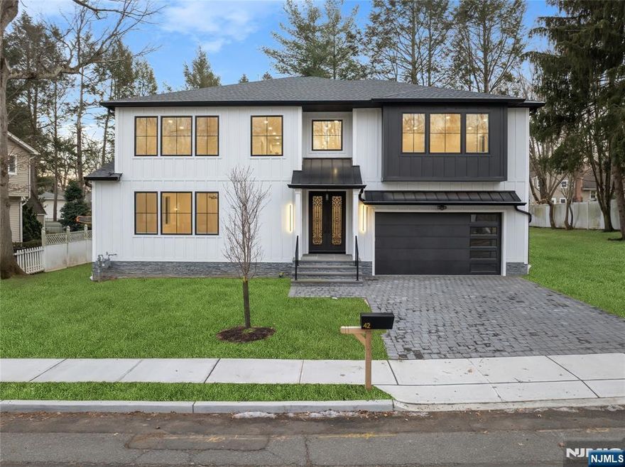 Welcome to this brand-new modern residence that seamlessly blends sleek design with cutting-edge technology. Located in one of Closterâ€™s most desirable neighborhoods, this immaculate home offers the perfect balance of elegance, comfort, and innovation. Enter through a striking double-height foyer and living room filled with natural lightâ€”ideal for both entertaining and everyday living. The home features a state-of-the-art smart living system with integrated lighting, climate control, and door locks, accessible by touch or voice command. High-end finishes include wide-plank hardwood floors, oversized picture windows, and a cozy fireplace. The gourmet kitchen is equipped with premium Thermador appliances, including a double-door refrigerator, range, microwave, and oven, along with quartz countertops, custom cabinetry, and a spacious center island. A separate butlerâ€™s pantry provides added convenience and style. The elegant dining room is perfect for intimate dinners or larger gatherings and includes a built-in wine cooler. Upstairs, the luxurious primary suite offers a spa-inspired bath with soaking tub, rain shower, radiant heated floors, and a custom walk-in closet. Additional bedrooms are generously sized and feature en-suite baths with modern finishes. Owner is related to the listing agent.