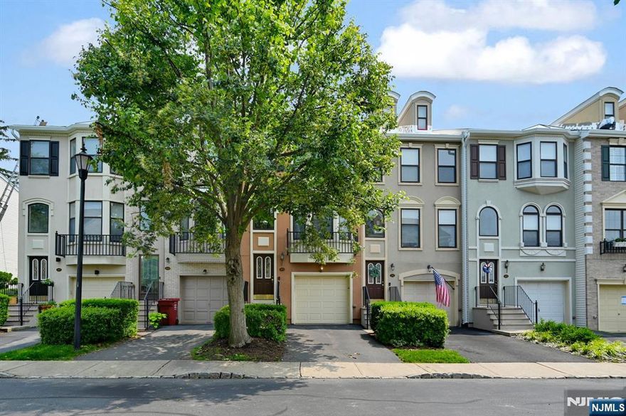 Classic, Turn-Key Brownstone in Coveted Cambridge Heights, Nutley. Welcome to one of the largest models in the desirable gated community of Cambridge Heights, offering over 2,000 sq ft across three levels with extensive recent upgrades for modern living. Enjoy peace of mind with significant upgrades, including a new roof, HVAC system, and water heater, all replaced in 2024. Additionally, the property features Alexa Smart Switches, Recessed Lighting, a new garage door, and an epoxy-coated floor. The property also includes a Reverse Osmosis Drinking Water Filtration System, an EV Charger, and All-New Appliances (installed between 2020 and 2025). Main Level Highlights: Chef's kitchen featuring wood cabinetry, granite countertops, stainless steel appliances, and a custom center island with additional storage; open-concept living room with a gas fireplace; formal dining room with a bay window; and a powder room. The 2nd floor includes a spacious primary suite with walk-in shower, deep soaking tub, and double vanity; a Second large bedroom and full hall bath; and a Separate Laundry area conveniently located upstairs. The lower level features a flexible Family/Rec room with direct access to the patio, yard, and garage, as well as an additional full bathroom. It boasts gleaming floors, high ceilings, and abundant natural light. Enjoy the community's top-tier amenities, manicured grounds, and unbeatable location near shopping, dining, and NYC transportation.