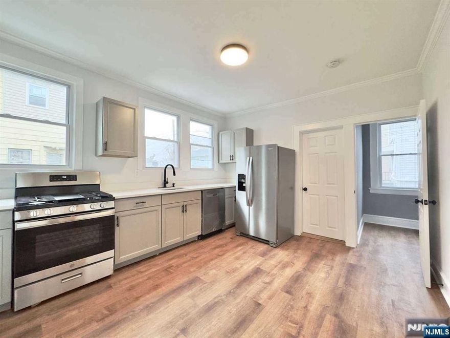 We are thrilled to present the sale of a recently renovated legal 2-family property in the heart of East Orange, NJ! This extraordinary residence spans two stories, encompassing a total of 2,320 sq ft, along with a spacious 1,160 sq ft raw basement, all situated on a generous 4,000 sqft lot. The property boasts expansive front and rear yards, creating ample outdoor space for various activities. Additionally, a private side driveway provides convenient parking with three car spaces. Each floor features a distinct entrance unit, comprising 3 bedrooms, 1 bathroom, 1 kitchen, 1 living room, and a walk-in storage room. The property is equipped with new central heating and cooling system. Don't miss the opportunity to open the new chapter of refined living in East Orange!