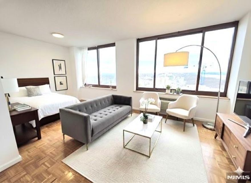 Luxury condo 1 BR on high 33rd floor for rent with open view of Hudson River, GWB and Manhattan. 857 SF open concept layout with two separate dining areas which can be converted as work space. Full open view without any neighboring windows for best privacy. Private unit entrance. Most appliances are new/newer except refrigerator. Well kept owner occupied unit will give very welcoming feeling. One deeded garage (9-29) on 9th floor included in rent. Gym, summer swimming pool, huge outdoor promenade. Walk to all restaurants, cafes, banks, super markets, yoga, dance classes, shops, churches, schools and townhall. Easy commute to NJ, NY with cars, buses and ferry. Owner has NJ RE license. No pets, no smoking allowed.