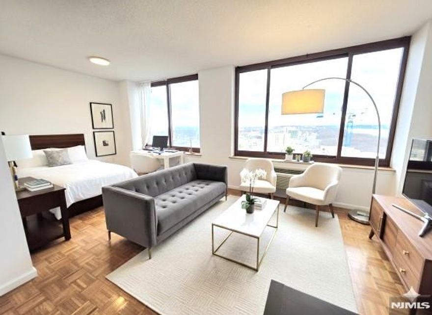 Luxury condo 1 BR on high 33rd floor for rent with open view of Hudson River, GWB and Manhattan. 857 SF open concept layout with two separate dining areas which can be converted as work space. Full open view without any neighboring windows for best privacy. Private unit entrance. Most appliances are new/newer except refrigerator. Well kept owner occupied unit will give very welcoming feeling. One deeded garage (9-29) on 9th floor included in rent. Gym, summer swimming pool, huge outdoor promenade. Walk to all restaurants, cafes, banks, super markets, yoga, dance classes, shops, churches, schools and townhall. Easy commute to NJ, NY with cars, buses and ferry. Owner has NJ RE license. No pets, no smoking allowed.