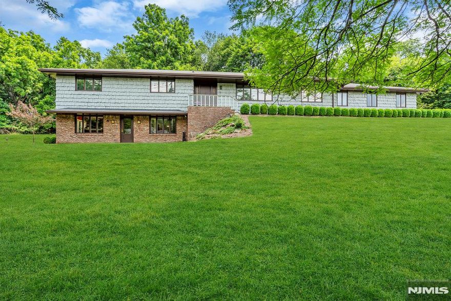 True One of a Kind Ranch home set at the Top of a Hill with Spectacular Curb Appeal. This amazing Personal Residence Features an Exquisite Main Level with 3 Bedrooms and 2 Baths and a Huge Ground Level that was once used as an Office & now Offers Endless Potential. The Main Level of this Gorgeous Property Features an Entry Foyer w/ Pegged Hardwood Floors, a Coat Closet & Recessed Lighting, a Formal Living Room w/a Picture Window & Hardwood Floors, a Formal Dining Room, a Sunlit Eat-in-Kitchen w/a Skylight, SS Appliances, Recessed Lighting & a Breakfast Area, a Sensational Family Room w/pegged Hdwd Floors, a Brick Fireplace, Recessed Lighting & Sliding Glass Doors to the Patio. The Bedroom area is accessed through a quaint Pocket Door and offers a Master Bedroom w/Huge Closets and a Full Master Bath with 2 Separate Sinks, a Stall Shower & a Dressing Table, 2 Addl Bedrooms w/Huge Ample Closet Space & a 2nd Fully Tiled Bath also with 2 Sinks, a Tub & Shower & a Dressing Table. The Unique Ground Level was once used as a Real Estate Office & has an Entry Foyer and Reception Area, 2 Large Rooms w/multiple Cubicles, 2 Conference Rooms, a Large Open Room w/a Sink, a Small Private Office & a Half Bath. There is also parking for 15-20 vehicles. This area could be converted to any number of things such as a Media Room, Additional Bedrooms, Exercise Space etc. Outside the spacious property is beautifully landscaped. There is also Central Air, a 2 Car Att Garage, a Workshop and Much More