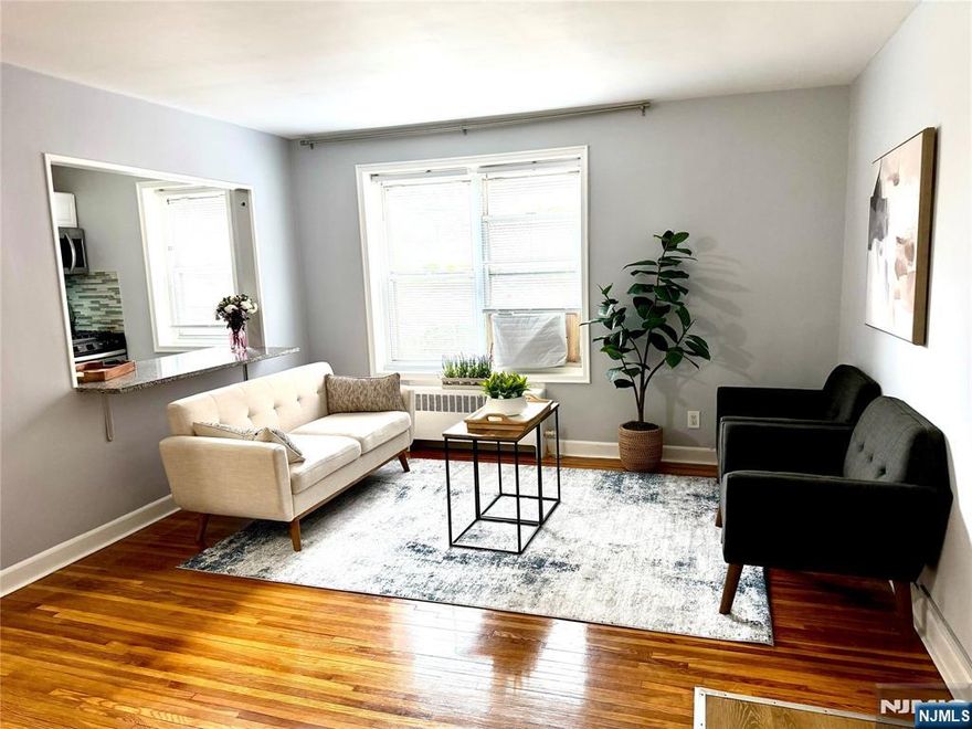 Welcome to Bella Vista. Bright one bedroom apartment on the 1st floor of a well maintained mid rise, featuring hardwood floors throughout with great natural light. Good size living room and bedroom with lots of closets. Updated kitchen and bath. Steps from Linwood Plaza with HMART, Chipotle, Starbucks and more. NYC buses near by and 5 minutes to GW Bridge. Perfect for commuters. Assigned parking spot included. Heat and hot water included! Laundry on premises.