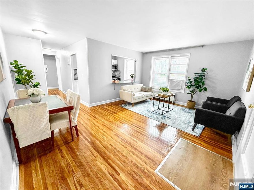 Welcome to Bella Vista. Bright one bedroom apartment on the 1st floor of a well maintained mid rise, featuring hardwood floors throughout with great natural light. Good size living room and bedroom with lots of closets. Updated kitchen and bath. Steps from Linwood Plaza with HMART, Chipotle, Starbucks and more. NYC buses near by and 5 minutes to GW Bridge. Perfect for commuters. Assigned parking spot included. Heat and hot water included! Laundry on premises.