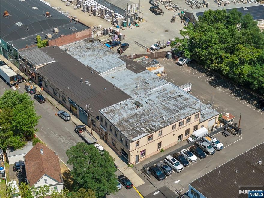 Unlock the potential of this 23,275 SF industrial/warehouse space in a prime Clifton location. Featuring a 16' clear height, large drive-in bay, open floor plan, central A/C, private restrooms, recessed lighting, and a security system, this property is ideal for light manufacturing, distribution, or storage. Ample on-site parking and easy access to Route 21, Route 3, the Garden State Parkway, and NYC make it a strategic choice for growing businesses. Listed rate includes utilities, building services, and property expenses.